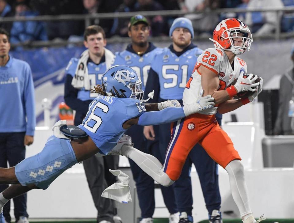Clemson wide receiver Cole Turner (22) catches a ball near North Carolina defensive back DeAndre Boykins (16) during the second quarter of the ACC Championship football game at Bank of America Stadium in Charlotte, North Carolina Saturday, Dec 3, 2022. Clemson Tigers Football Vs North Carolina Tar Heels Acc Championship Charlotte Nc