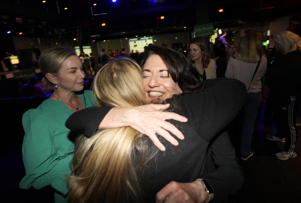 Denver mayoral candidate Kelly Brough is congratulated by well-wishers during an election eve watch party late Tuesday, April 4, 2023, in north Denver. Brough and Mike Johnston were the leading vote-getters in the race, which fielded 16 candidates. (AP Photo/David Zalubowski)