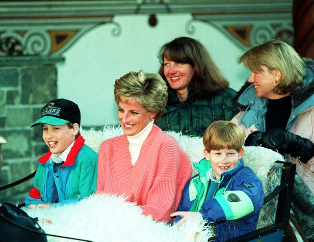 File photo dated 27/03/94 of the Princess of Wales and her two sons, Prince William (left) and Prince Harry, riding in a horse-drawn sleigh as they leave their hotel in Lech, Austria