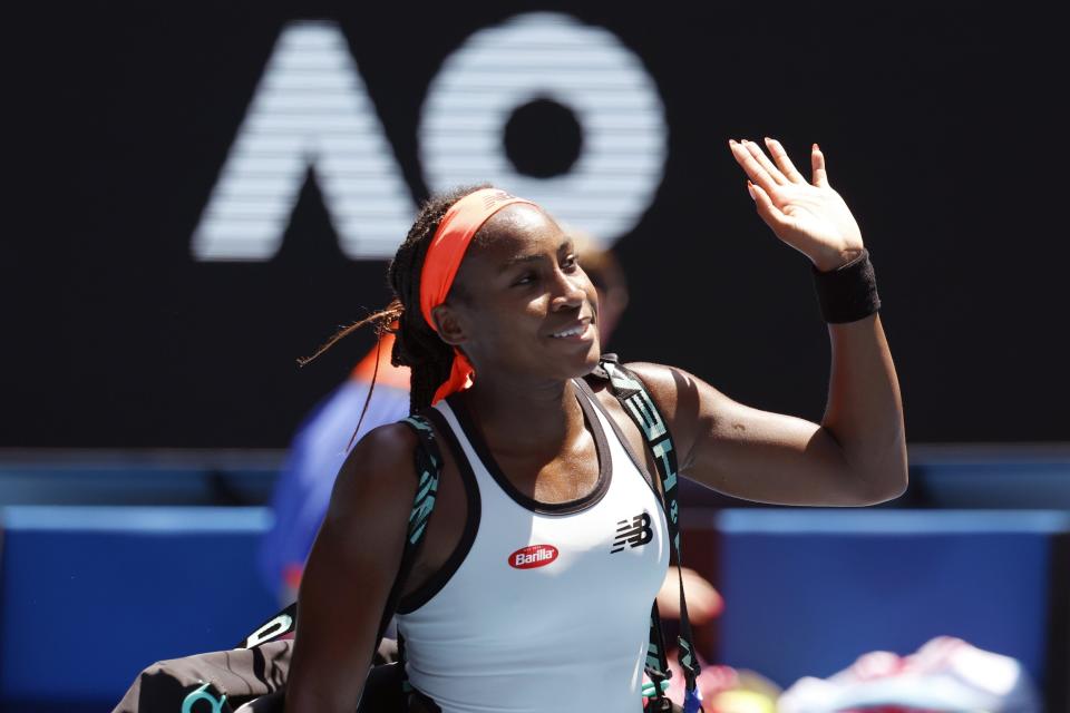 Coco Gauff of the U.S. waves at the crowd as she leaves the court following her fourth round loss to Jelena Ostapenko of Latvia at the Australian Open tennis championship in Melbourne, Australia, Sunday, Jan. 22, 2023. (AP Photo/Asanka Brendon Ratnayake)