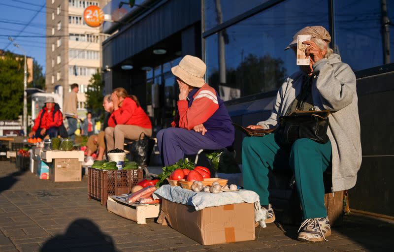 Vendors sell vegetables and other foodstuffs in a street in Izhevsk