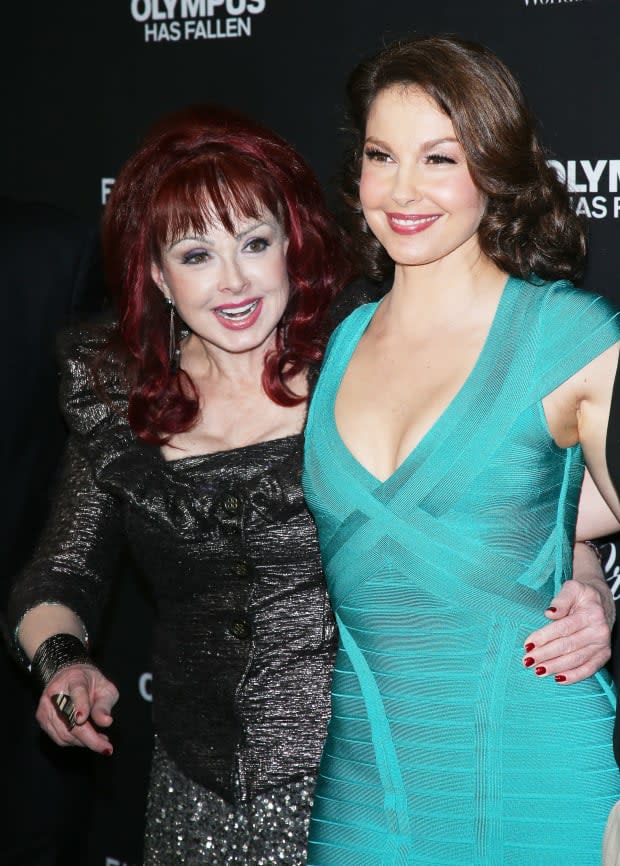 HOLLYWOOD, CA - MARCH 18: Ashley Judd (R) and Naomi Judd arrive at the Los Angeles premiere of "Olympus Has Fallen" held at ArcLight Cinemas Cinerama Dome on March 18, 2013 in Hollywood, California. (Photo by Michael Tran/FilmMagic)<p><a href="https://www.gettyimages.com/detail/164029793" rel="nofollow noopener" target="_blank" data-ylk="slk:Michael Tran/Getty Images;elm:context_link;itc:0;sec:content-canvas" class="link ">Michael Tran/Getty Images</a></p>