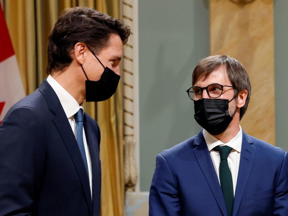 Canada's Prime Minister Justin Trudeau speaks with Minister of Environment and Climate Change Steven Guilbeault during the cabinet's swearing-in ceremony at Rideau Hall in Ottawa