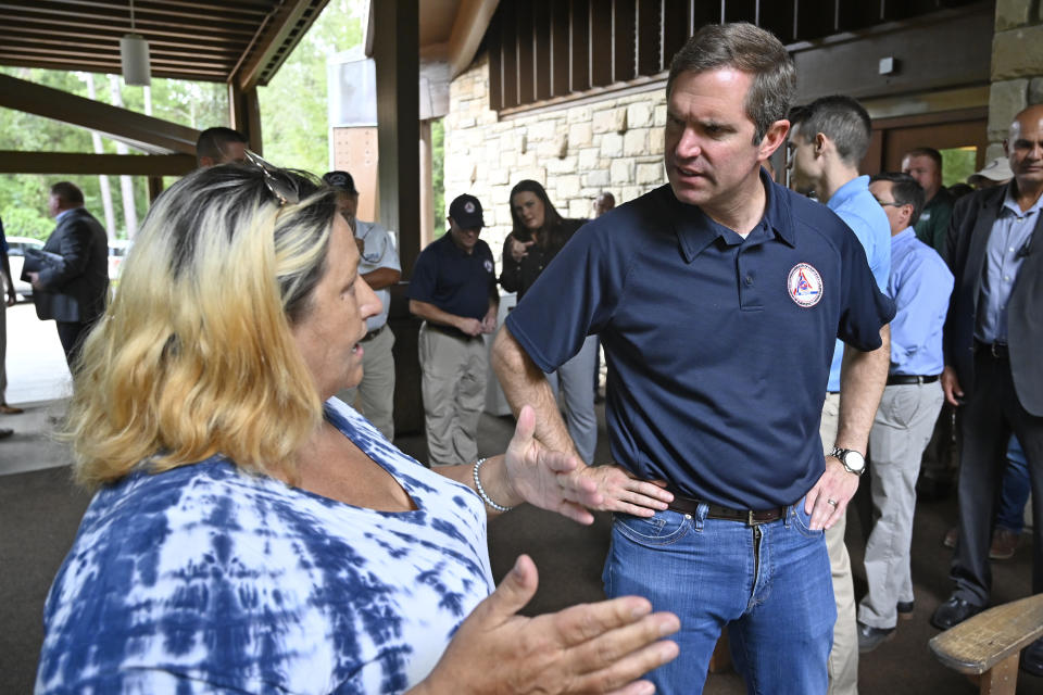 Kentucky Gov. Andy Beshear, right, speaks with Pansi McCoy at Jenny Wiley State Park in Prestonsburg, Ky., Tuesday, Sept. 6, 2022. Despite being a Democratic governor in a Republican dominated state, Beshear has a large amount of support from Kentucky residents. (AP Photo/Timothy D. Easley)