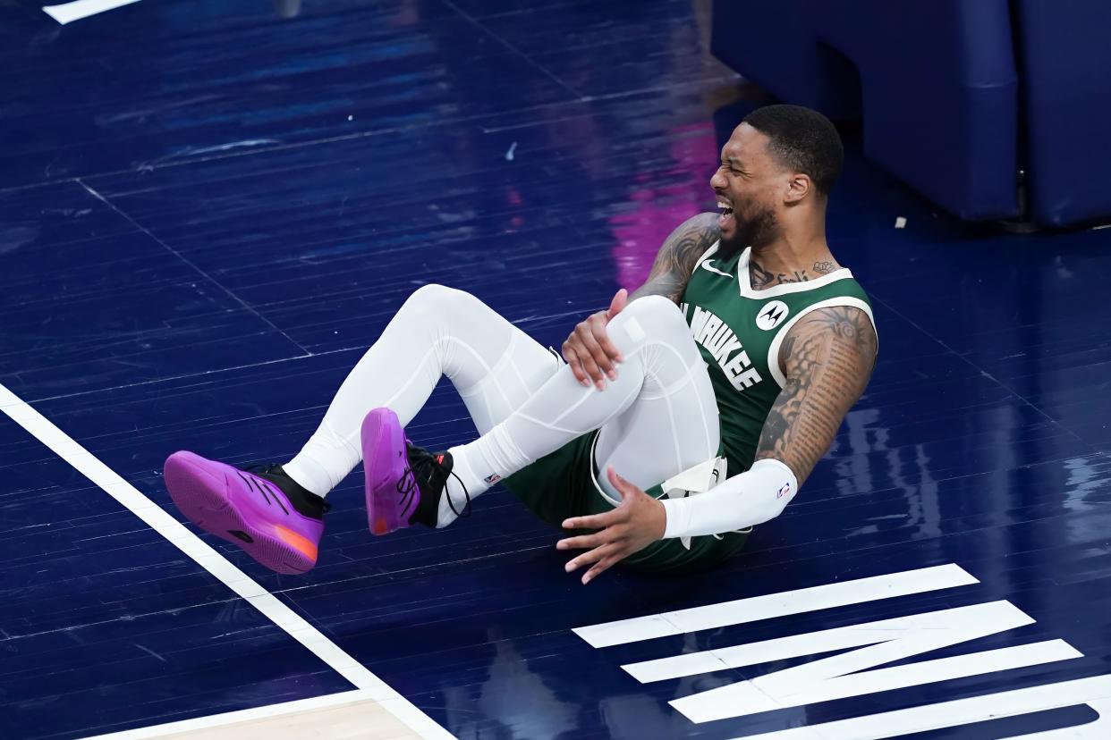 INDIANAPOLIS, INDIANA - APRIL 26: Damian Lillard #0 of the Milwaukee Bucks reacts after being injured in the first quarter against the Indiana Pacers during game three of the Eastern Conference First Round Playoffs at Gainbridge Fieldhouse on April 26, 2024 in Indianapolis, Indiana. NOTE TO USER: User expressly acknowledges and agrees that, by downloading and or using this photograph, User is consenting to the terms and conditions of the Getty Images License Agreement. (Photo by Dylan Buell/Getty Images)