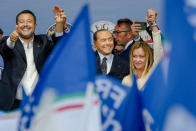 FILE - From left, The League's Matteo Salvini, Forza Italia's Silvio Berlusconi, and Brothers of Italy's Giorgia Meloni attend the final rally of the center-right coalition in central Rome, Thursday, Sept. 22, 2022. Just in time to celebrate his 86th birthday, Italy’s former premier Silvio Berlusconi is making his return to Italy's parliament, winning a seat in the Senate nearly a decade after being banned from public office over a tax fraud conviction.(AP Photo/Alessandra Tarantino, File)