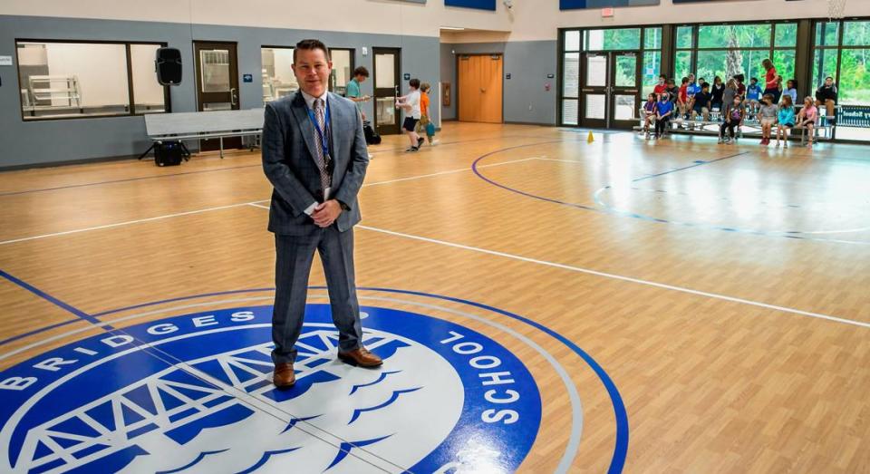 Gary S. McCulloch, CEO and Head of School at Bridges Preparatory School poses for a photo after removing his face covering in the Multipurpose/Cafeteria on Thursday, Oct. 29, 2020 in Beaufort. McCulloch expects the student population at the fast-growing charter school currently at 1,072 to reach 1,470 by 2023.