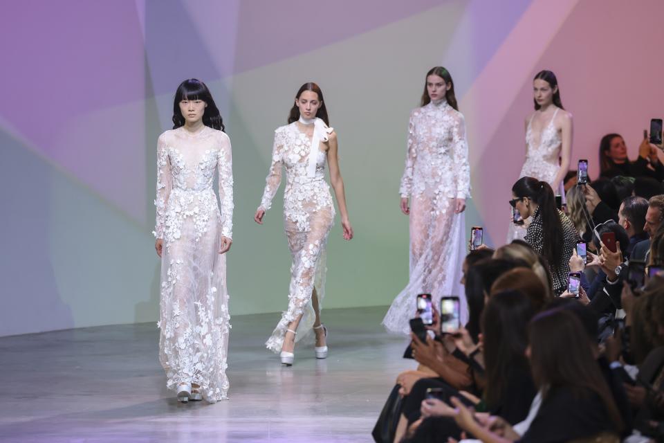 Models wear creations for the Elie Saab ready-to-wear Spring/Summer 2023 fashion collection presented Saturday, Oct. 1, 2022 in Paris. (Photo by Vianney Le Caer/Invision/AP)