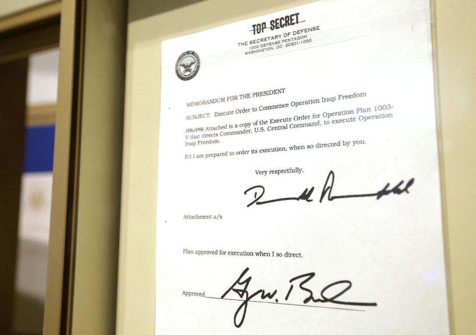 File- This May 1, 2013 file photo shows the Top Secret executive order commencing operation Iraqi Freedom signed by former President George W. Bush hangs in the Bush Presidential Library and Museum in Dallas. The George W. Bush Presidential Library and Museum is set to begin accepting Freedom of Information Act requests for records from Bush’s presidency. The library will start taking requests Monday Jan. 20, 2014, which marks five years from the end of Bush’s presidency. (AP Photo/Tony Gutierrez, File)