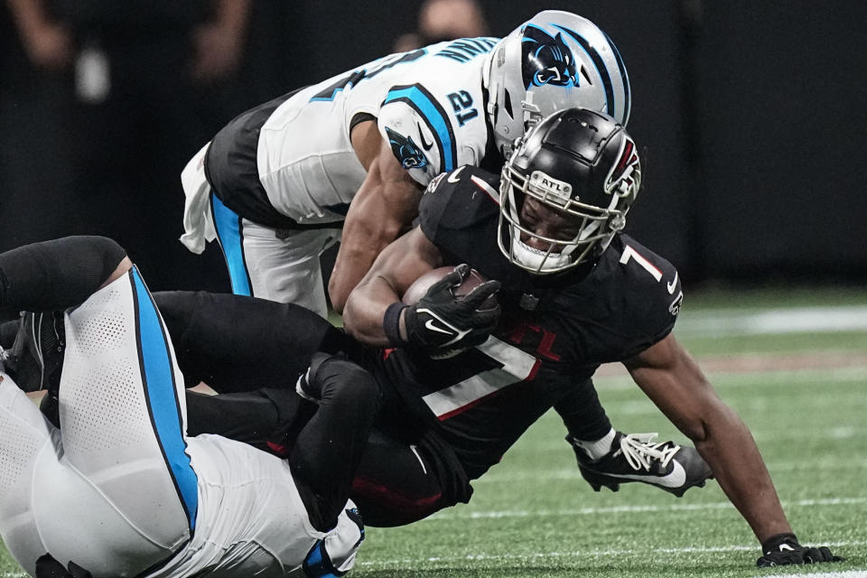 Carolina Panthers safety Jeremy Chinn (21) hits Atlanta Falcons running back Bijan Robinson (7) during the second half of an NFL football game, Sunday, Sept. 10, 2023, in Atlanta. (AP Photo/John Bazemore)