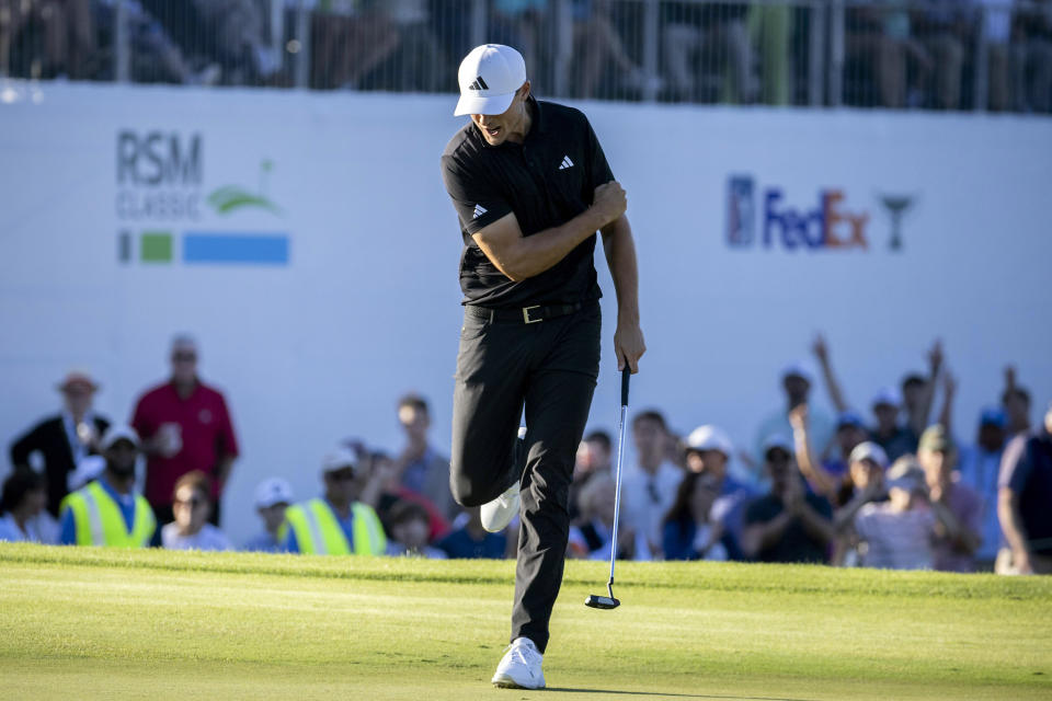 Ludvig Åberg, of Sweden, reacts after his putt on the 18th green during the final round of the RSM Classic golf tournament, Sunday, Nov. 19, 2023, in St. Simons Island, Ga. (AP Photo/Stephen B. Morton)