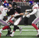 New York Giants linebacker Lorenzo Carter, left, prepares to sack Atlanta Falcons quarterback Matt Ryan (2) during the first half of an NFL football game, Monday, Oct. 22, 2018, in Atlanta. (AP Photo/John Amis)