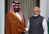 Saudi Arabia's Crown Prince Mohammed bin Salman shakes hands with Prime Minister Narendra Modi ahead of their meeting at Hyderabad House in New Delhi, February 20, 2019. REUTERS/Adnan Abidi