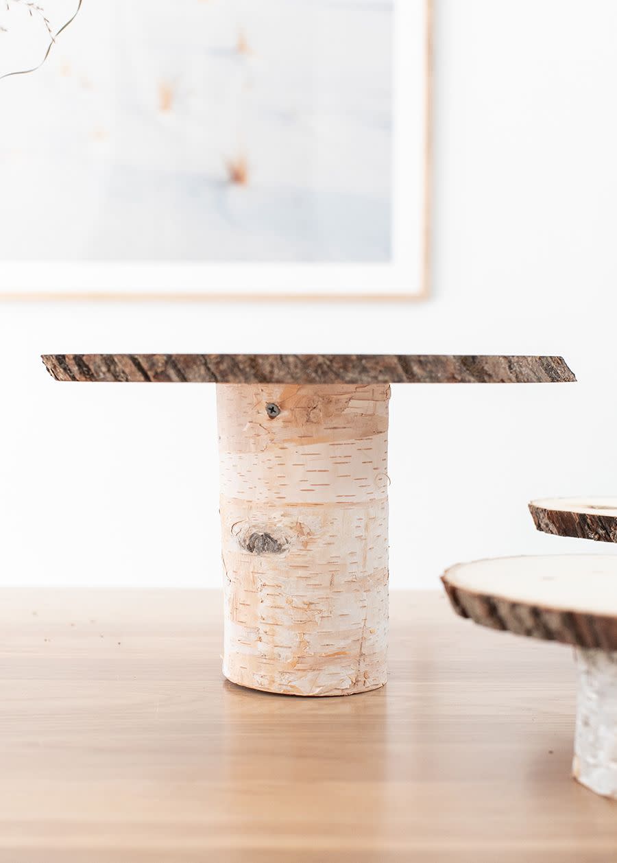 <p>If you're going to bake a pie from scratch, you might as well show it off properly. This rustic cake stand gives you the chance to do just that—and it's inexpensive to boot.</p><p><strong>Get the tutorial at <a href="https://sugarandcharm.com/diy-thanksgiving-dessert-table" rel="nofollow noopener" target="_blank" data-ylk="slk:Sugar and Charm;elm:context_link;itc:0;sec:content-canvas" class="link ">Sugar and Charm</a>.</strong></p><p><strong><a class="link " href="https://www.amazon.com/Fuyit-4-7-5-1-Unfinished-Christmas-Ornaments/dp/B085Q1SCNZ/ref=sr_1_2_sspa?tag=syn-yahoo-20&ascsubtag=%5Bartid%7C10050.g.2063%5Bsrc%7Cyahoo-us" rel="nofollow noopener" target="_blank" data-ylk="slk:SHOP WOOD SLICES;elm:context_link;itc:0;sec:content-canvas">SHOP WOOD SLICES</a><br></strong></p>