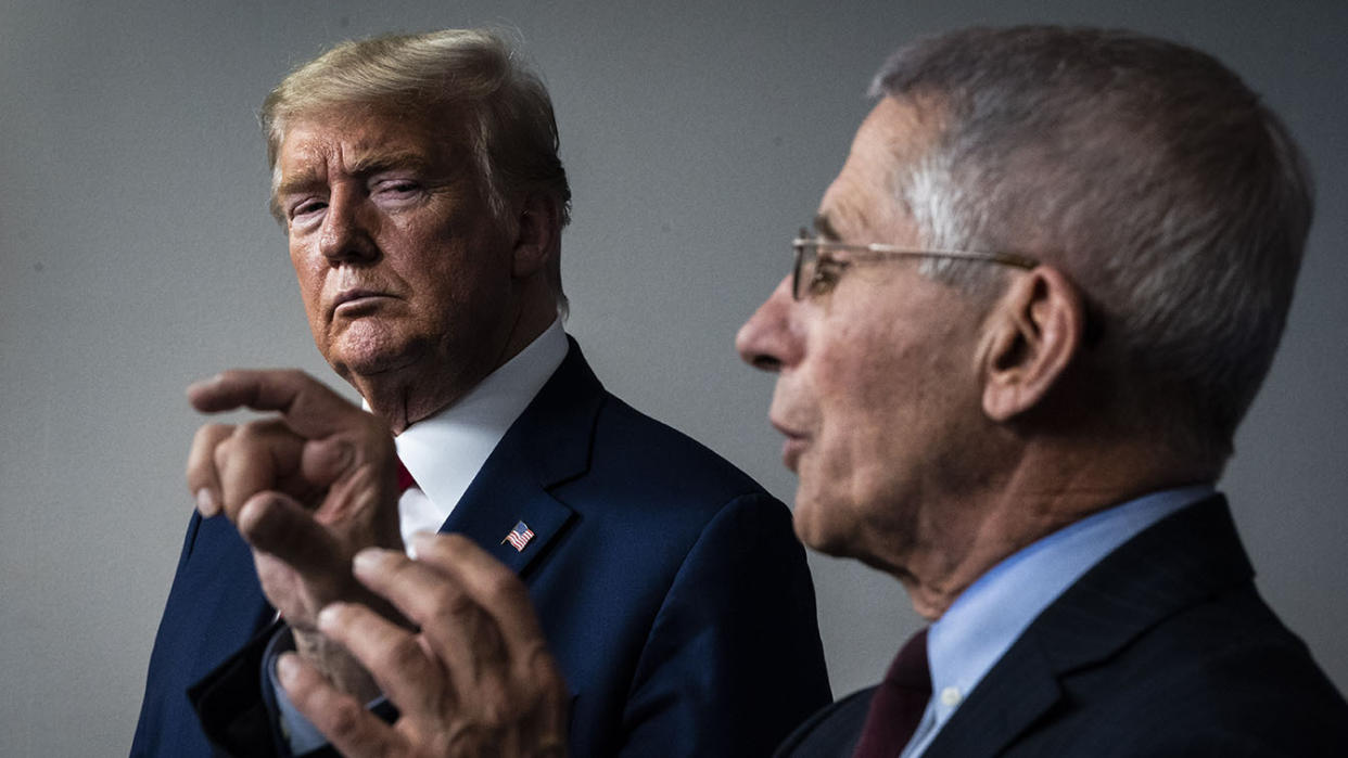 President Donald Trump listens as Dr. Anthony Fauci speaks during a briefing on the coronavirus pandemic in March 2020. (Jabin Botsford/The Washington Post via Getty Images)