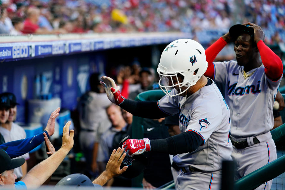 Miami Marlins' Avisail Garcia is congratulated by teammates after his two-run home run off Philadelphia Phillies' Zach Eflin during the first inning of a baseball game Tuesday, June 14, 2022, in Philadelphia. (AP Photo/Matt Rourke)