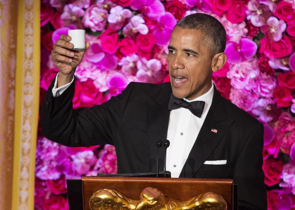 U.S. President Obama toasts Japanese PM Abe with sake at a State Dinner at the White House