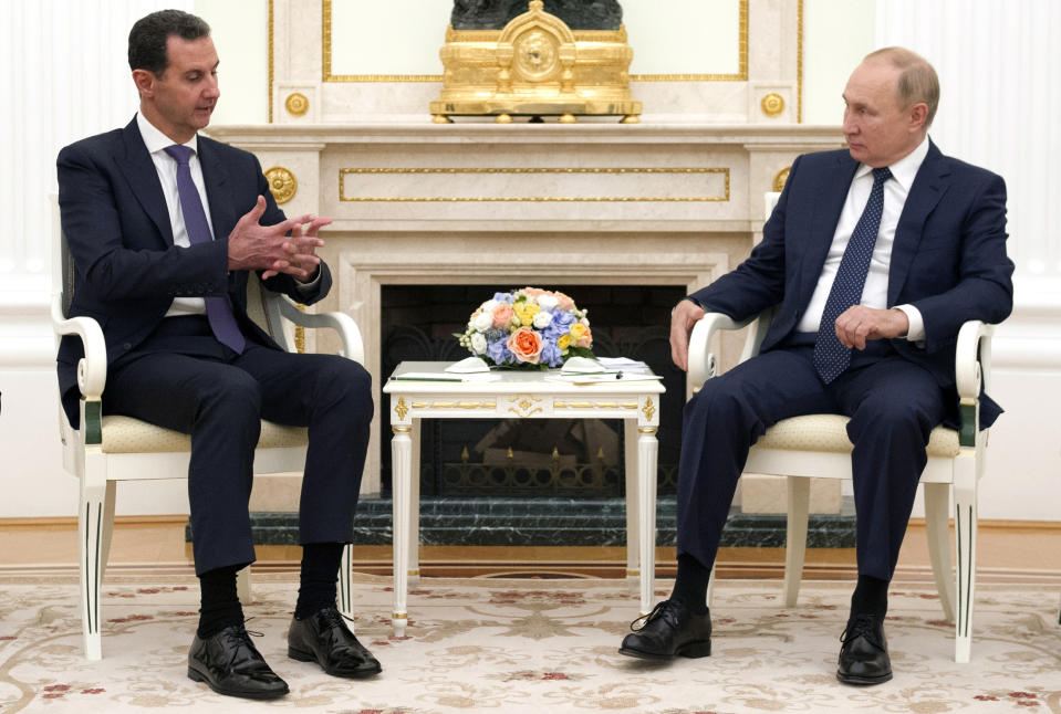 Russian President Vladimir Putin, right, sits with Syrian President Bashar Assad during their meeting in the Kremlin in Moscow, Russia, Monday, Sept. 13, 2021. (Mikhail Klimentyev, Sputnik, Kremlin Pool Photo via AP)