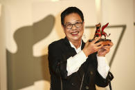 Director Ann Hui holds her Golden Lion award for Lifetime Achievement during the 77th edition of the Venice Film Festival in Venice, Italy, Tuesday, Sept. 8, 2020. (Photo by Joel C Ryan/Invision/AP)