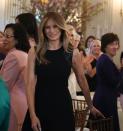 <p>For her Women's Day luncheon held at the White House, First Lady Melania wore a sleeveless Ralph Lauren dress with leather trim.</p>