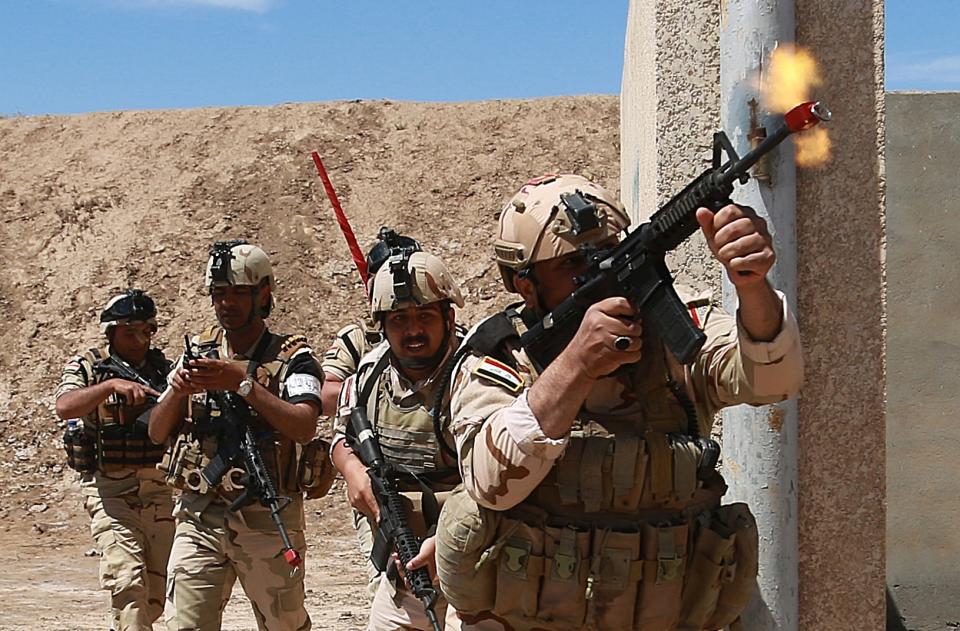 Australian and New Zealand coalition forces participate in a training mission with Iraqi army soldiers at Taji Base, north of Baghdad, Iraq, Wednesday, April 17, 2019. A month after the defeat of the Islamic State group in Syria and Iraq, the U.S.-led international coalition has turned its attention to training Iraqi forces to secure the country against lingering threats posed by IS cells operating in the countryside. (AP Photo/Hadi Mizban)