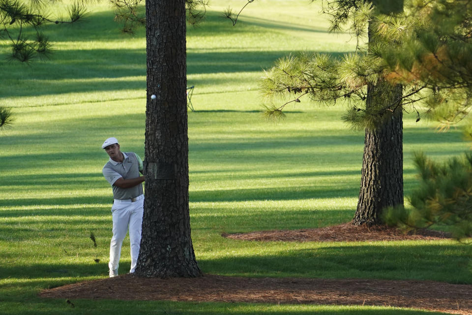 Bryson DeChambeau hits out of the rough on the seventh hole during the second round of the Masters golf tournament Friday, Nov. 13, 2020, in Augusta, Ga. (AP Photo/David J. Phillip)
