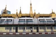 Man walks near Sule Pagoda amid the pandemic after authorities announced a stay-at-home order, in Yangon