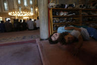 Children play in a mosque, ahead of prayers in Istanbul, Wednesday, Aug. 15, 2018. The Turkish lira currency has nosedived in value in the past week over concerns about Turkey's President Recep Tayyip Erdogan's economic policies and after the United States slapped sanctions on Turkey angered by the continued detention of an American pastor. (AP Photo/Lefteris Pitarakis)