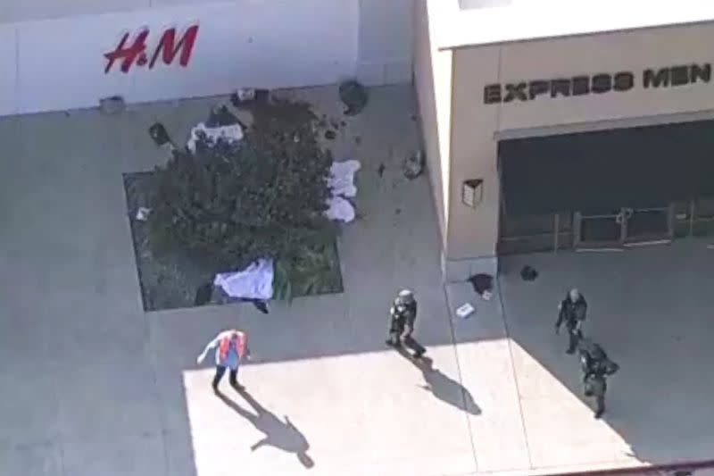 Police respond to a shooting in the Dallas area's Allen Premium Outlets