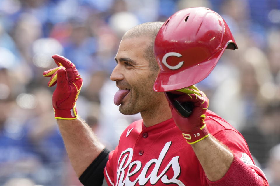 Cincinnati Reds' Joey Votto celebrates his solo home run against the Toronto Blue Jays during eighth-inning baseball game action in Toronto, Sunday, May 22, 2022. (Frank Gunn/The Canadian Press via AP)