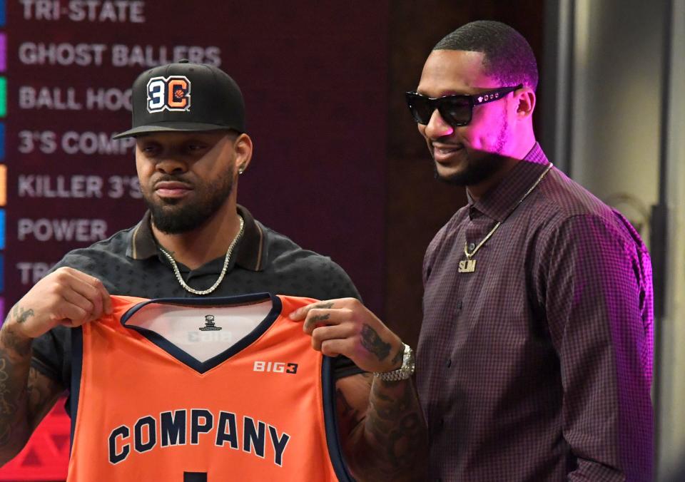 Andre Emmett, left, poses with 3's Company co-captain DerMarr Johnson after being selected as the No. 2 pick during the BIG3 draft, as seen Thursday, April 12, 2018, in Los Angeles.