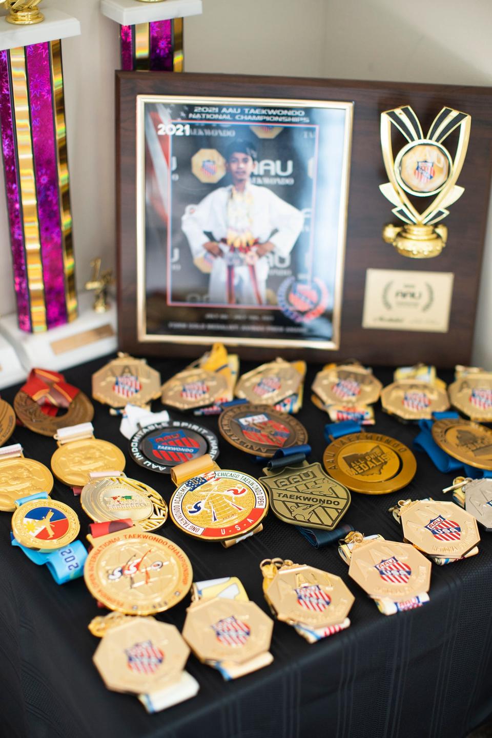 A few of Avinav Prem Anand's martial arts medals adorn a table in his family's apartment.