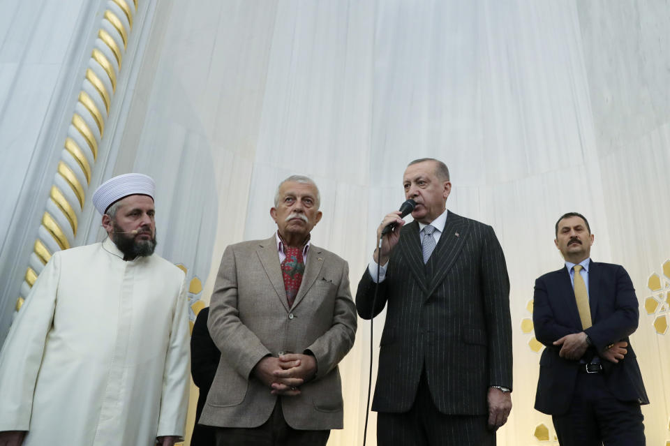 Turkey's President Recep Tayyip Erdogan speaks to people after Friday prayers inside Buyuk Camlica Mosque, in Istanbul, Friday, March 6, 2020. Russian President Vladimir Putin and Erdogan said late Thursday in Moscow, they have reached agreements that could end fighting in northwestern Syria. (Presidential Press Service via AP, Pool)