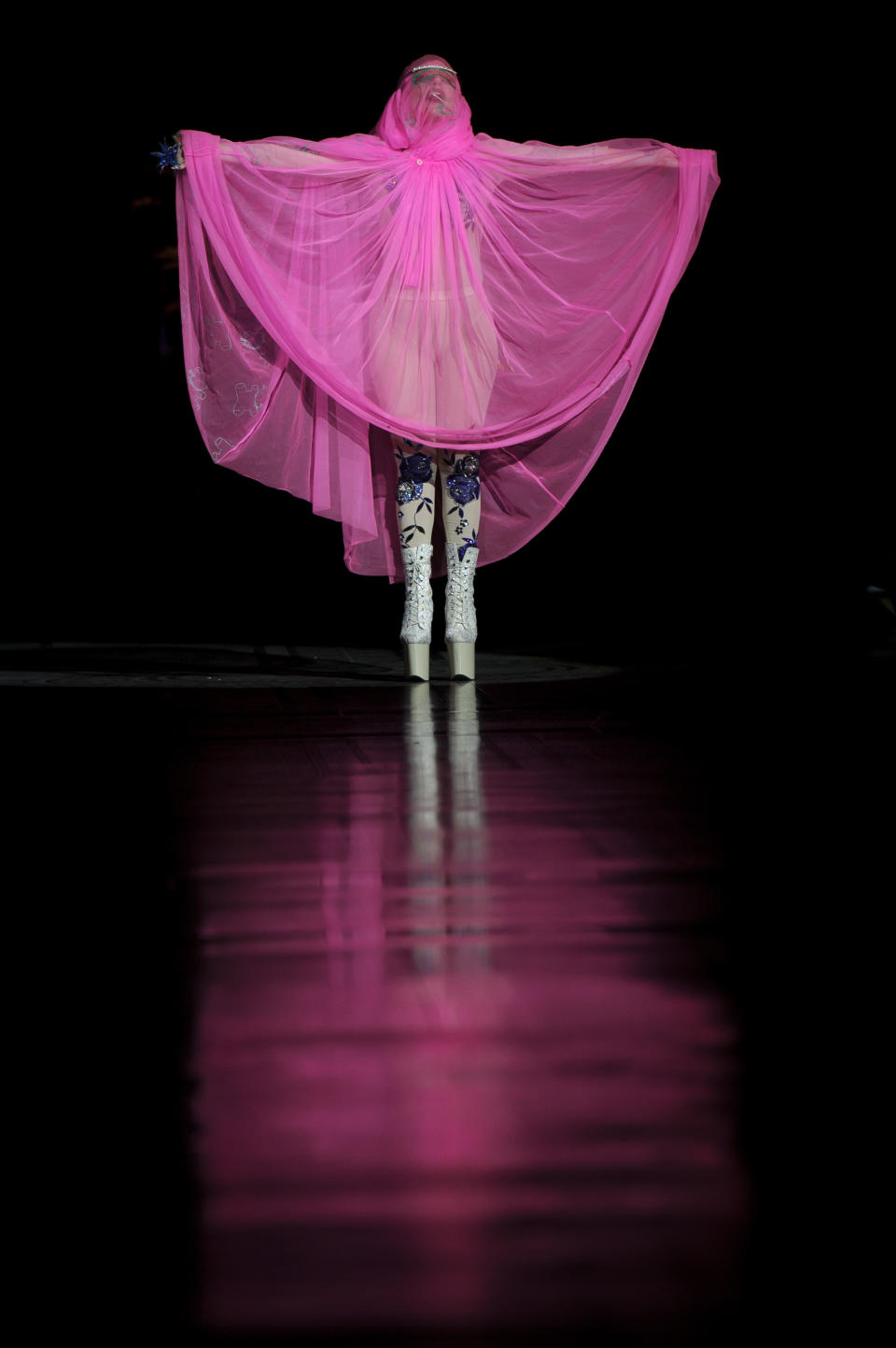 U.S singer Lady Gaga opens the Philip Treacy Spring/Summer 2013 collection during London Fashion Week, Sunday, Sept. 16, 2012. (AP Photo/Jonathan Short)