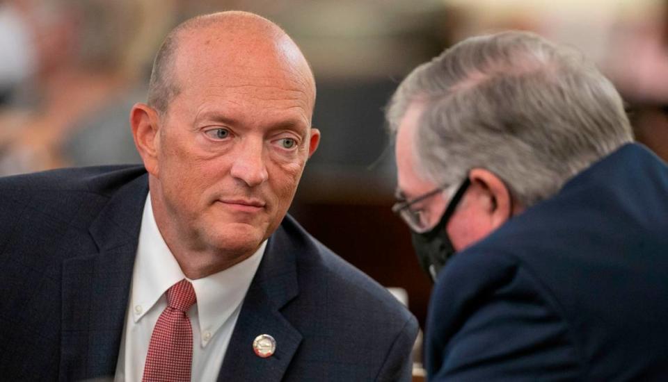 Rep. Dean Arp of Monroe, N.C. confers with Rep. Donny Lambeth of Winston-Salem, during the House session on Wednesday, September 8, 2021 in Raleigh, N.C.