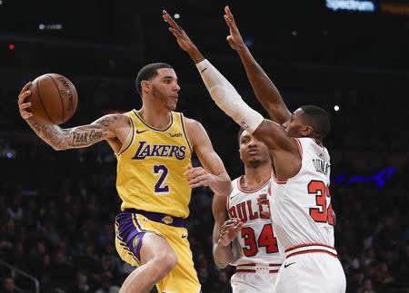 Jan 15, 2019; Los Angeles, CA, USA; Los Angeles Lakers guard Lonzo Ball (2) passes the ball while Chicago Bulls guard Kris Dunn (32) and forward Wendell Carter Jr. (34) defend during the second quarter at Staples Center. Mandatory Credit: Kelvin Kuo-USA TODAY Sports