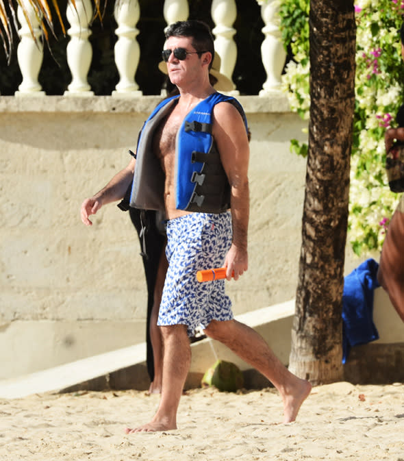 Simon Cowell is spotted on the beach in Barbados<P>Pictured: Simon Cowell <P><B>Ref: SPL672171  221213  </B><BR/>Picture by: Islandpaps / Splash News<BR/></P><P><B>Splash News and Pictures</B><BR/>Los Angeles:310-821-2666<BR/>New York:212-619-2666<BR/>London:870-934-2666<BR/>photodesk@splashnews.com<BR/></P>
