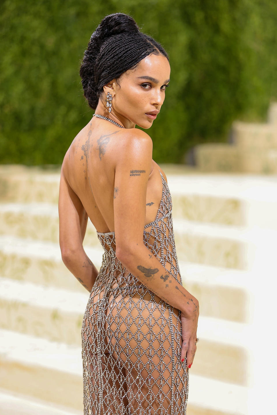 Zoë on the Met Gala steps in a sheer chain-link dress