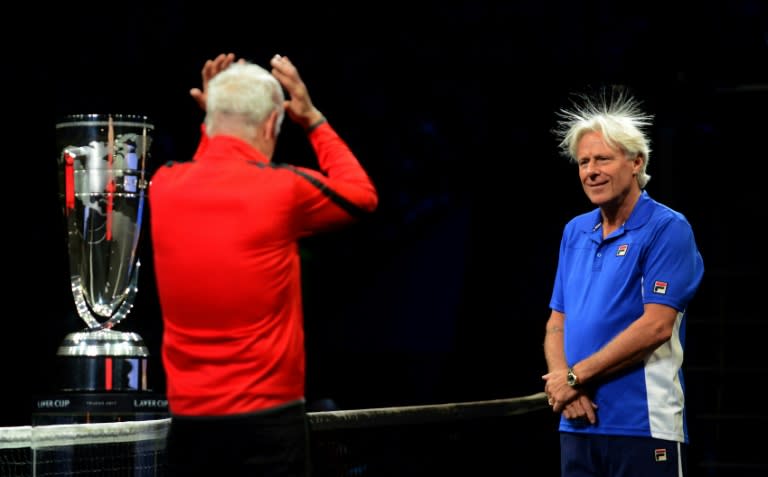 Swedish Bjorn Borg, captain of Team Europe and US John Mcenroe, captain of Team World react during the line up at the start at the start of the first day of Laver Cup on September 22, 2017 in Prague