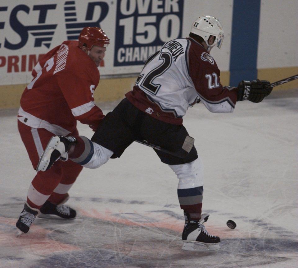 Wings defenseman Vladimir Konstantinov forces Avalanche's Claude Lemieux to lose the puck during Game 2 at McNichols Sports Arena in Denver, May 17, 1997.