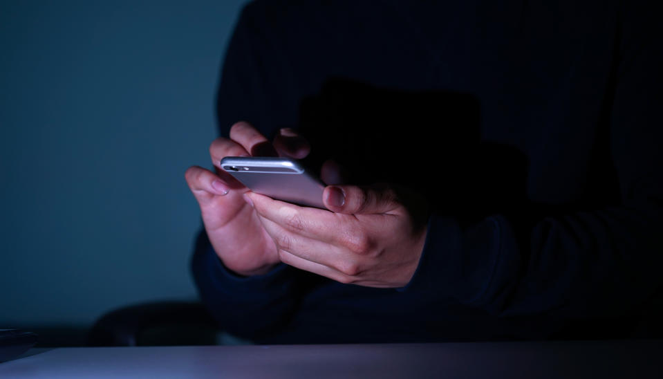 Picture of a person using their mobile phone, technology and smart phones have changed the way we communicate and was the basis for socialisation during the coronavirus lockdowns. 