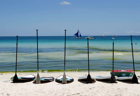 Paddle boats are seen in a row on an empty beach a day before the temporary closure of the holiday island Boracay in the Philippines April 25, 2018. REUTERS/Erik De Castro