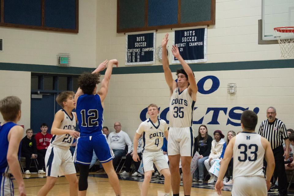 Gavyn Carden (12) shoots from the field in the fourth quarter of Pittsford's game against Hillsdale Academy. Carden hit 11 triples during the triple overtime game, tying a school for 3-pointers in a single game.