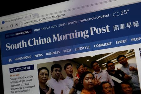 A photo illustration shows the South China Morning Post website displayed on a table computer in Hong Kong, China, November 23, 2015. REUTERS/Tyrone Siu