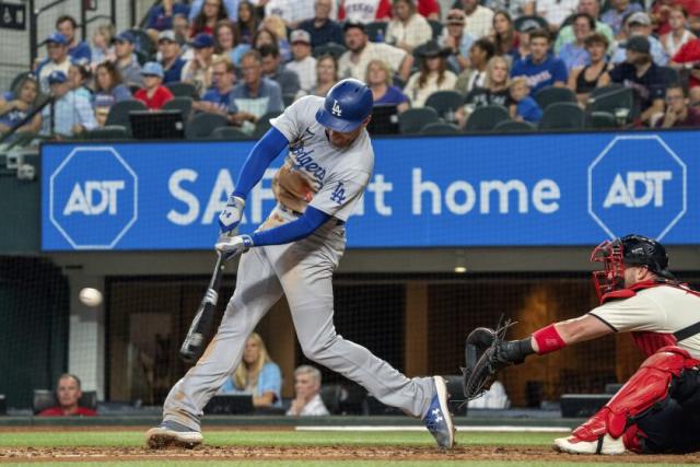 Freddie Freeman of the Los Angeles Dodgers runs to the dugout