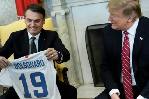 The meeting between Brazil's President Jair Bolsonaro and US President Donald Trump began with a light-hearted exchange of the US and Brazilian soccer jerseys