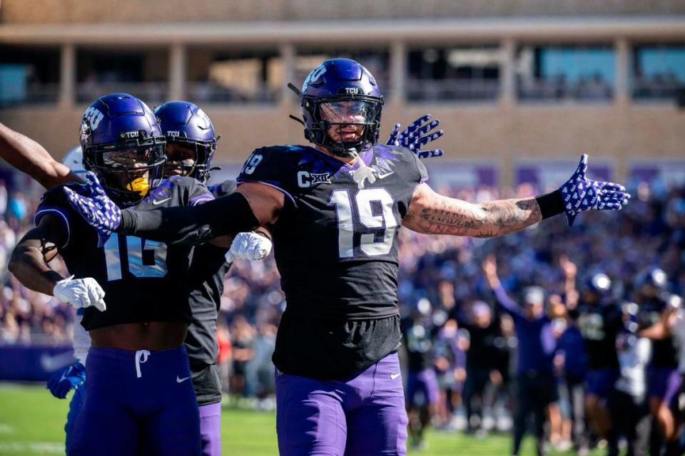 TCU Horned Frogs tight end Jared Wiley (19) and wide receiver Dylan Wright (16) celebrate after Wiley scores a touchdown against BYU during the game at Amon G. Carter Stadium on Oct. 14, 2023.