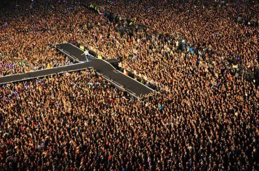 South Korean singer Park Jae-Sang, also known as Psy, performs during his free concert at Seoul on October 4, 2012. The municipal government closed off part of the city centre and extended subway operations for the estimated 80,000 fans who packed the open venue outside Seoul City Hall and spilled out into the surrounding streets