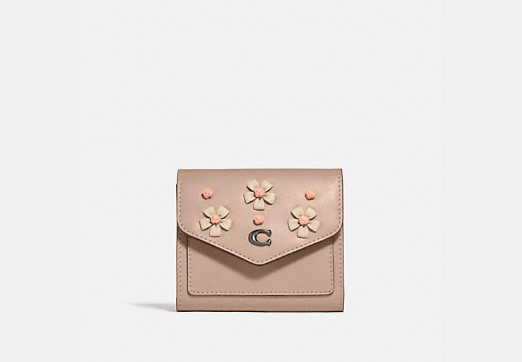 Wyn Small Wallet With Tea Rose Knot. Image via Coach.