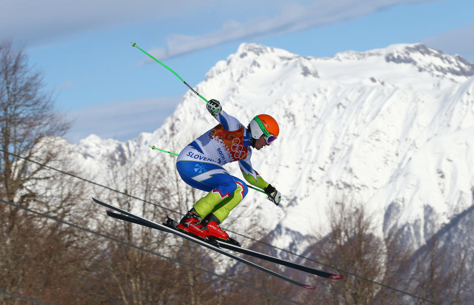 Slovenia's Rok Perko jumps during a men's downhill training run for the Sochi 2014 Winter Olympics, Saturday, Feb. 8, 2014, in Krasnaya Polyana, Russia. (AP Photo/Alessandro Trovati)